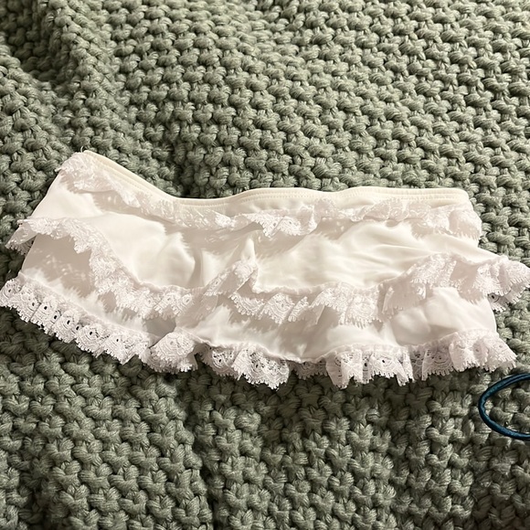 White bando bathing suit top with ruffles. - Picture 1 of 2